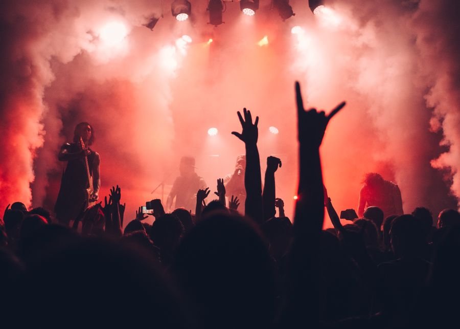 Band performing under stage lights